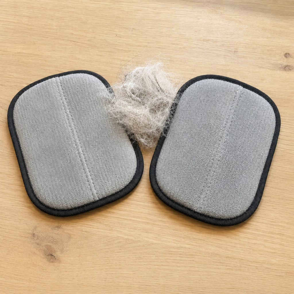 Two Rearpaw gloves with gathered pet hair
